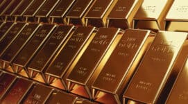 Gold bars stacked inside a vault illustrating the latest gold price forecast amid inflation fears, central bank uncertainty, and global financial instability