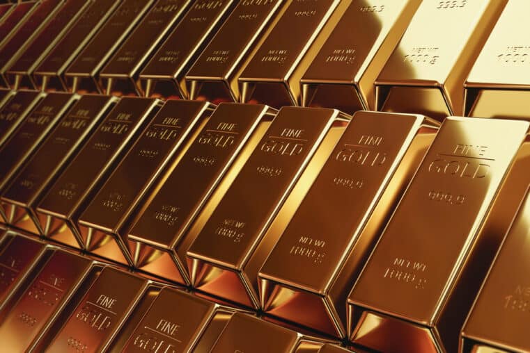 Gold bars stacked inside a vault illustrating the latest gold price forecast amid inflation fears, central bank uncertainty, and global financial instability