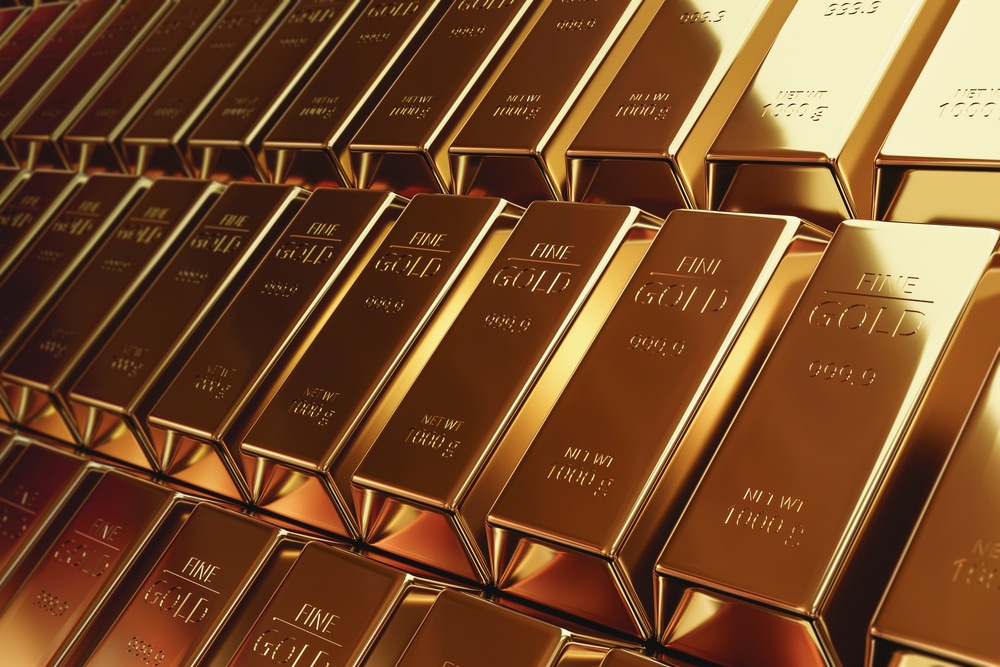 Gold bars stacked inside a vault illustrating the latest gold price forecast amid inflation fears, central bank uncertainty, and global financial instability