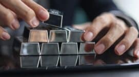 COMEX Silver Forecast concept showing silver bars, futures market data, and physical silver demand trends