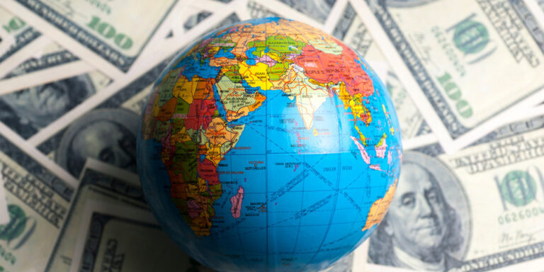 Dollar,Banknotes,Background,And,A,Globe,Model.,World,Control.,Control