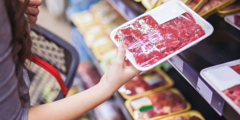 Close,Up,Of,Woman,Holding,Wrapped,Meat,In,Grocery,Store