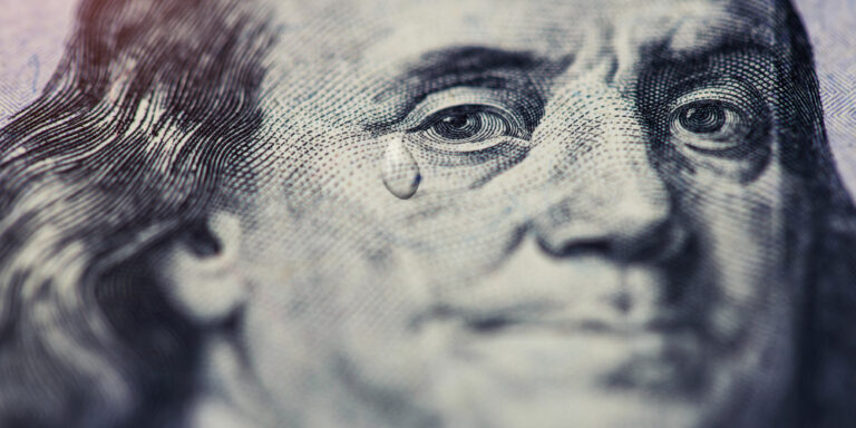 Tear,Falling,From,Face,On,Us,One,Hundred,Dollar,Bill,