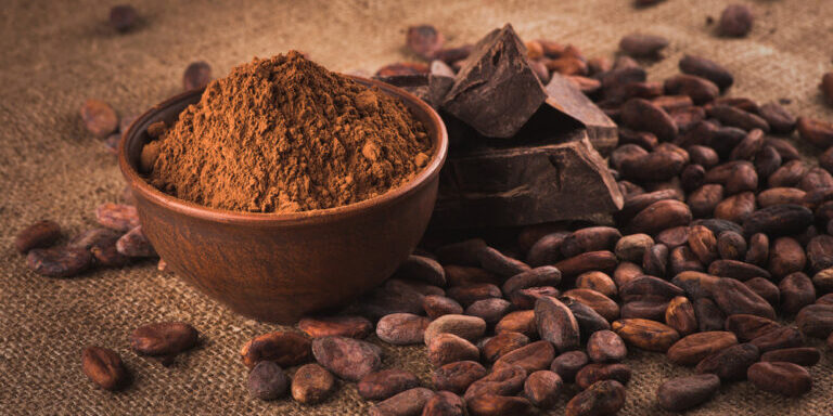Raw,Cocoa,Beans,,Clay,Bowl,With,Cocoa,Powder,,Chocolate,On
