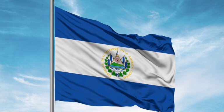 El,Salvador,National,Flag,Cloth,Fabric,Waving,On,Beautiful,Sky.