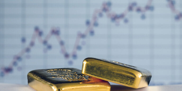 Gold,Bars,On,The,Background,Of,The,Growth,Chart.,Selective