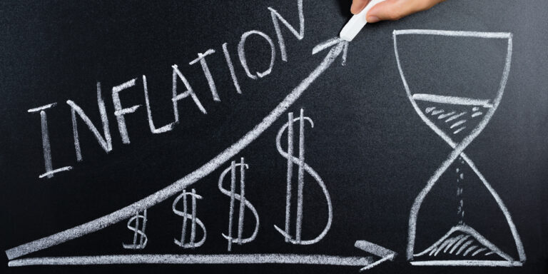 Person,Hand,Showing,Inflation,Concept,With,Dollar,Chart,And,Hourglass