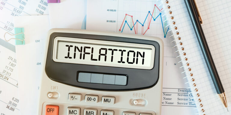 Inflation,Word,On,Calculator.,Business,And,Tax,Concept.