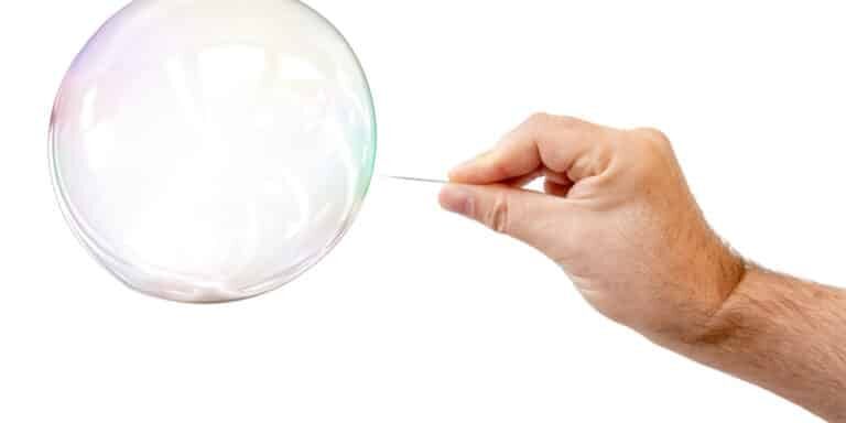 An,Image,Of,A,Soap,Bubble,And,A,Males,Hand