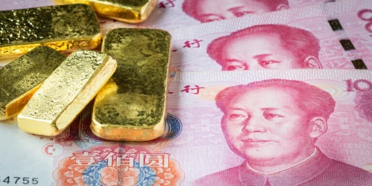 Stacked,Of,Gold,Bar,On,China,Banknote,,Chy,Or,Yuan