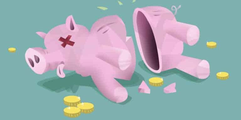 Broken,Piggy,Bank,On,Floor,With,Few,Coins.,Bankruptcy,And