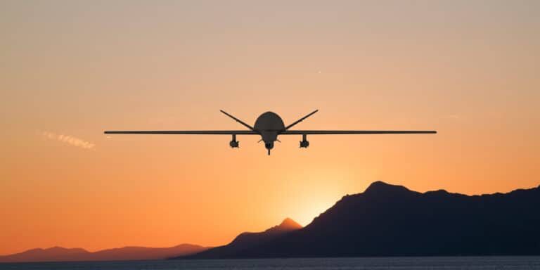 Silhouette,Of,Spy,Drone,Flying,Over,Sea,(uav),And,On