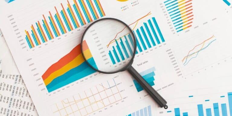 Business,Graphs,,Charts,And,Magnifying,Glass,On,Table.,Financial,Development,