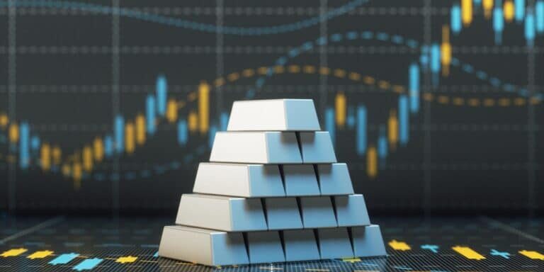 Silver,Bars,On,A,Background,With,Financial,Stock,Price,Graph.