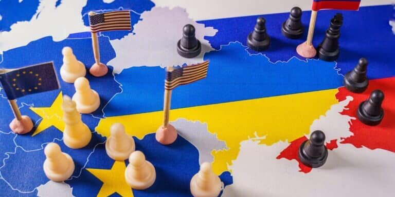 Eu,,Usa,And,Russian,Flags,With,Chess,Pieces,Symbolizing,The Eu,,Usa,And,Russian,Flags,With,Chess,Pieces,Symbolizing,The