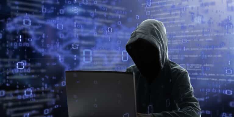 Hacker,At,Laptop.,Malware,And,Virus,Danger.,Man,In,Hoodie