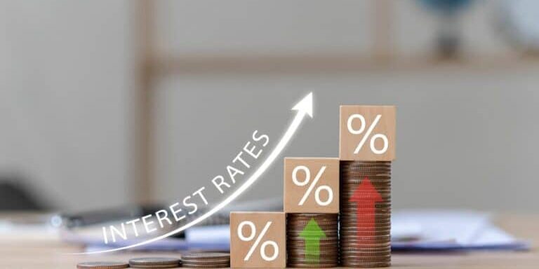 Interest,On,Stacks,Of,Us,Dollars,On,A,Wooden,Table