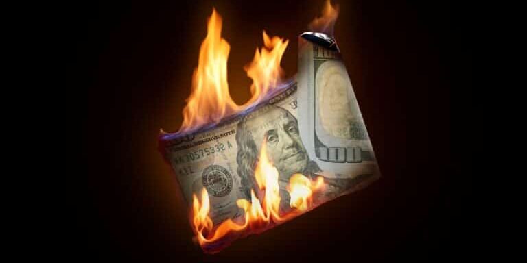 One,Hundred,Dollar,Banknote,Burning,On,Black,Background One,Hundred,Dollar,Banknote,Burning,On,Black,Background