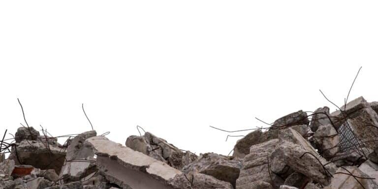 Large,Concrete,Fragments,Of,The,Remains,Of,A,Building,With