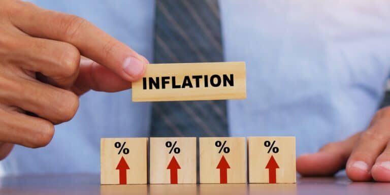 Hand,Putting,Wooden,Cube,And,Inflation,Word.idea,For,Fed,Consider