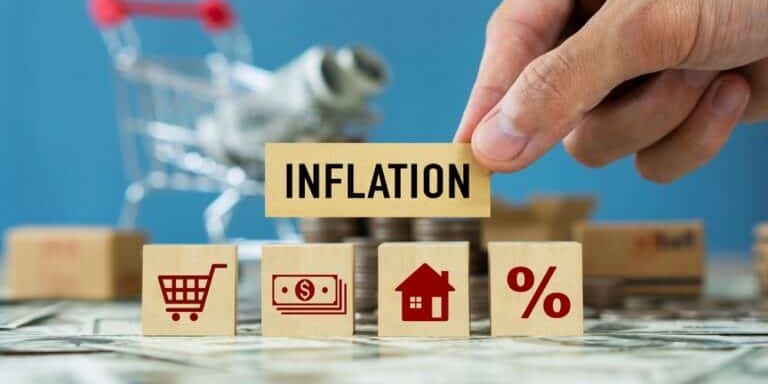 Inflation,Word,On,Wooden,Cube,With,With,Trading,Chart.idea,For