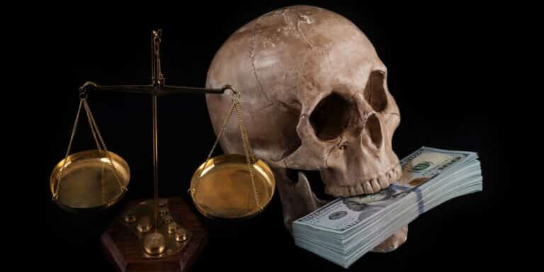Human,Skull,On,The,Background,,100,American,Dollar,Bills,And