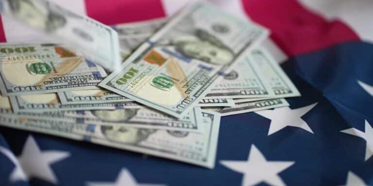 Dollar,Money,And,American,Flag.,Bankrupt,Man,Counting,Money,Cash. Dollar,Money,And,American,Flag.,Bankrupt,Man,Counting,Money,Cash.
