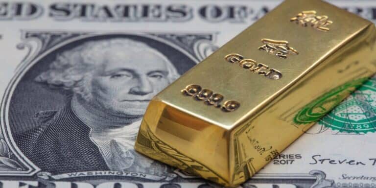 Gold,Bar,On,Us,1,Dollar,Background,For,Design,Purpose Middle East War Lifts Gold