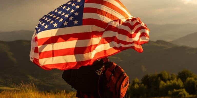 Young,Happy,American,Woman,With,Long,Hair,Holding,Waving,On