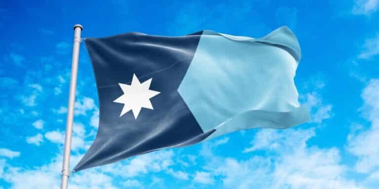 Minnesota,Flag,Waving,In,The,Wind,,Blue,Sky,Background