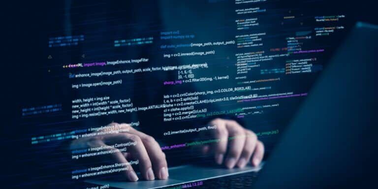 Hands,Typing,On,Laptop,With,Programming,Code,On,Screen,,Representing Hands,Typing,On,Laptop,With,Programming,Code,On,Screen,,Representing