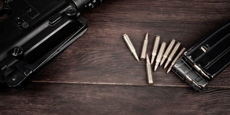 Rifle,And,Ammunition,With,Magazine,On,Wooden,Table,Background