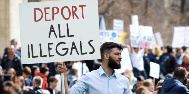 Angry,Man,Hold,Deport,All,Illegals,Banner.,Immigration,Crisis,Protest.