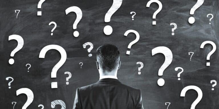 A,Person,In,A,Business,Suit,Faces,A,Chalkboard,With A,Person,In,A,Business,Suit,Faces,A,Chalkboard,With