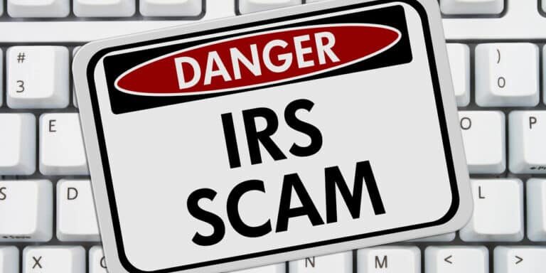 Irs,Scam,Danger,Sign,,A,Red,And,White,Sign,With