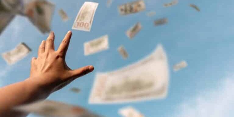 Hands,Reaching,For,Money,Floating,In,The,Air,Suggest,The