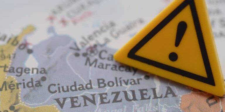 Venezuela,Crisis,Warning,Sign,On,Map,,Travel,Advisory,And