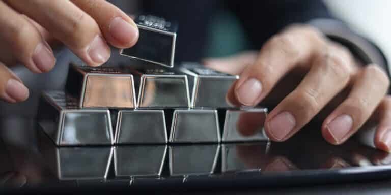 COMEX Silver Forecast concept showing silver bars, futures market data, and physical silver demand trends