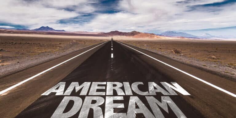 American Dream text painted on an empty highway symbolizing collapsing consumer confidence and economic uncertainty in America