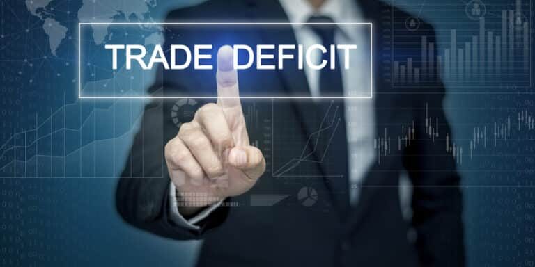 Businessman,Hand,Touching,Trade,Deficit,Button,On,Virtual,Screen