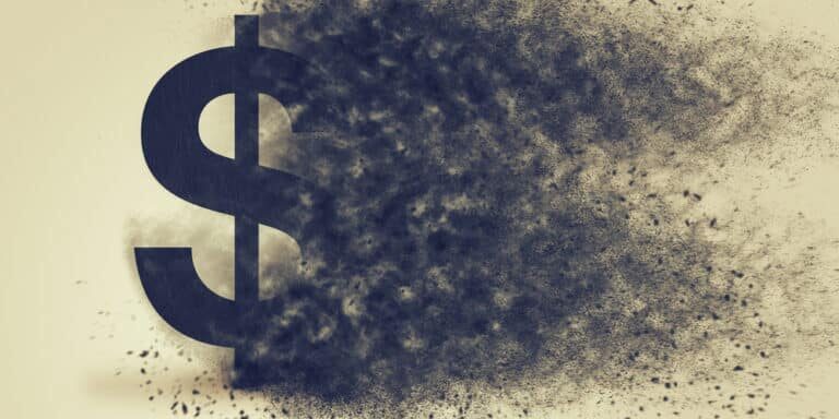 Dollar,Sign,Exploding,And,Dissolving,,Concept,Of,Currency,Devaluation,And