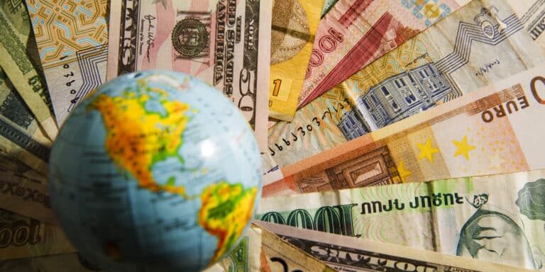 Globe,Map,Sign,Over,Many,American,Dollar,Bank,Notes,And