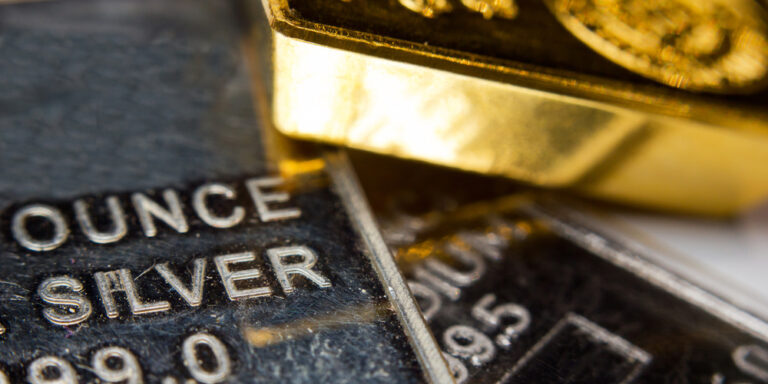 Close-up,Of,A,Gold-ingot,On,Top,Of,A,Troy,Ounce
