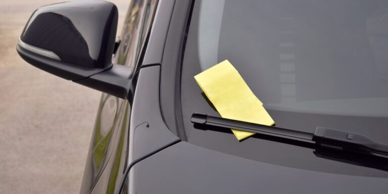 A,Yellow,Fine,Ticket,Under,The,Car,Wiper.,The,Vehicle