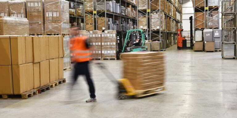 Warehouse,Worker,In,A,Forwarding,Agency,-,Interior,With,Forklift